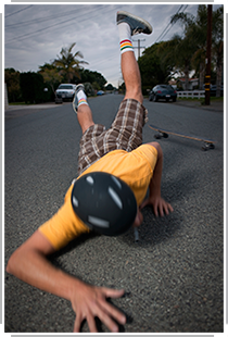 skateboarder falling on the pavement