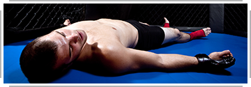martial arts fighter out cold on the mat