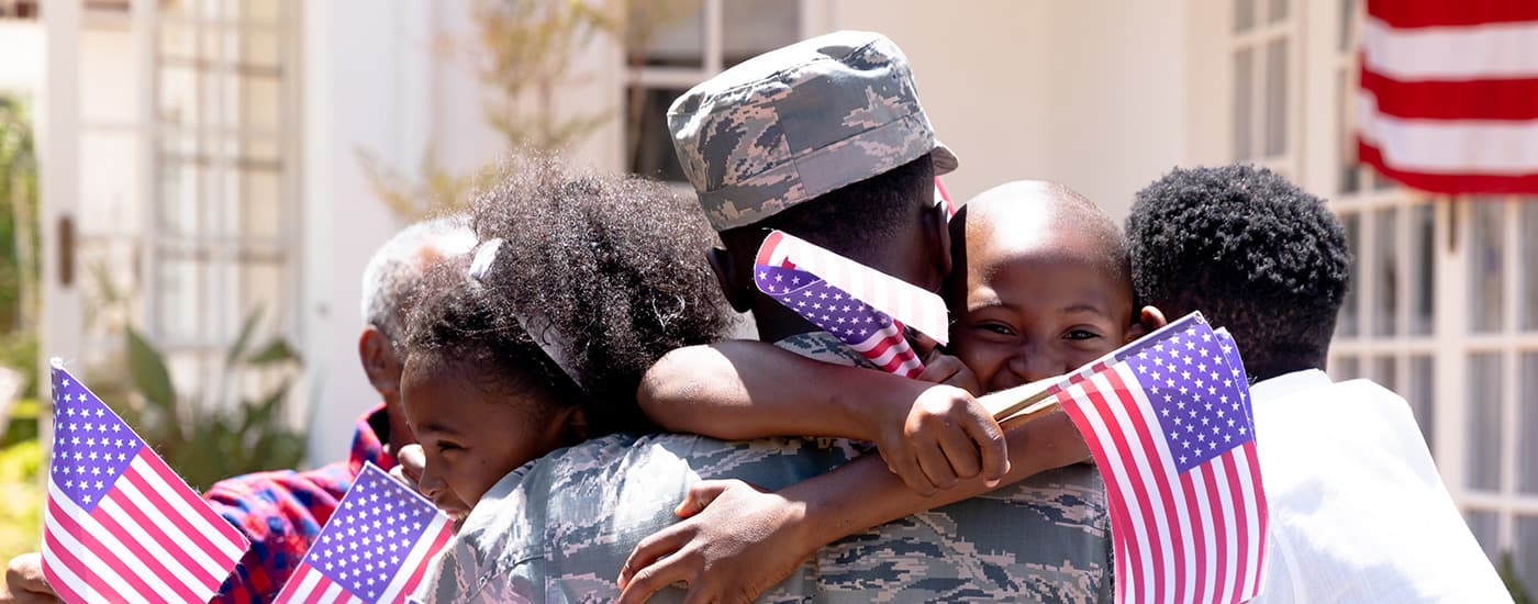 Family welcoming home their soldier.
